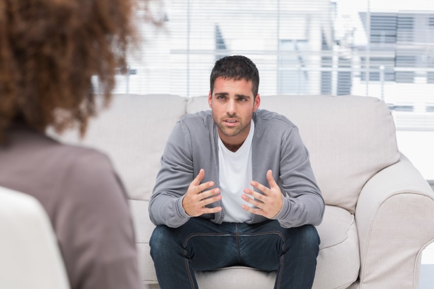 Man telling therapist his problems sitting on the couch